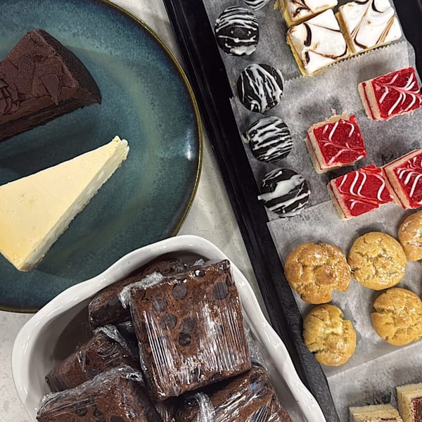 Assortment of Gabagool desserts including chocolate cake, cheesecake, brownies, and various pastries.